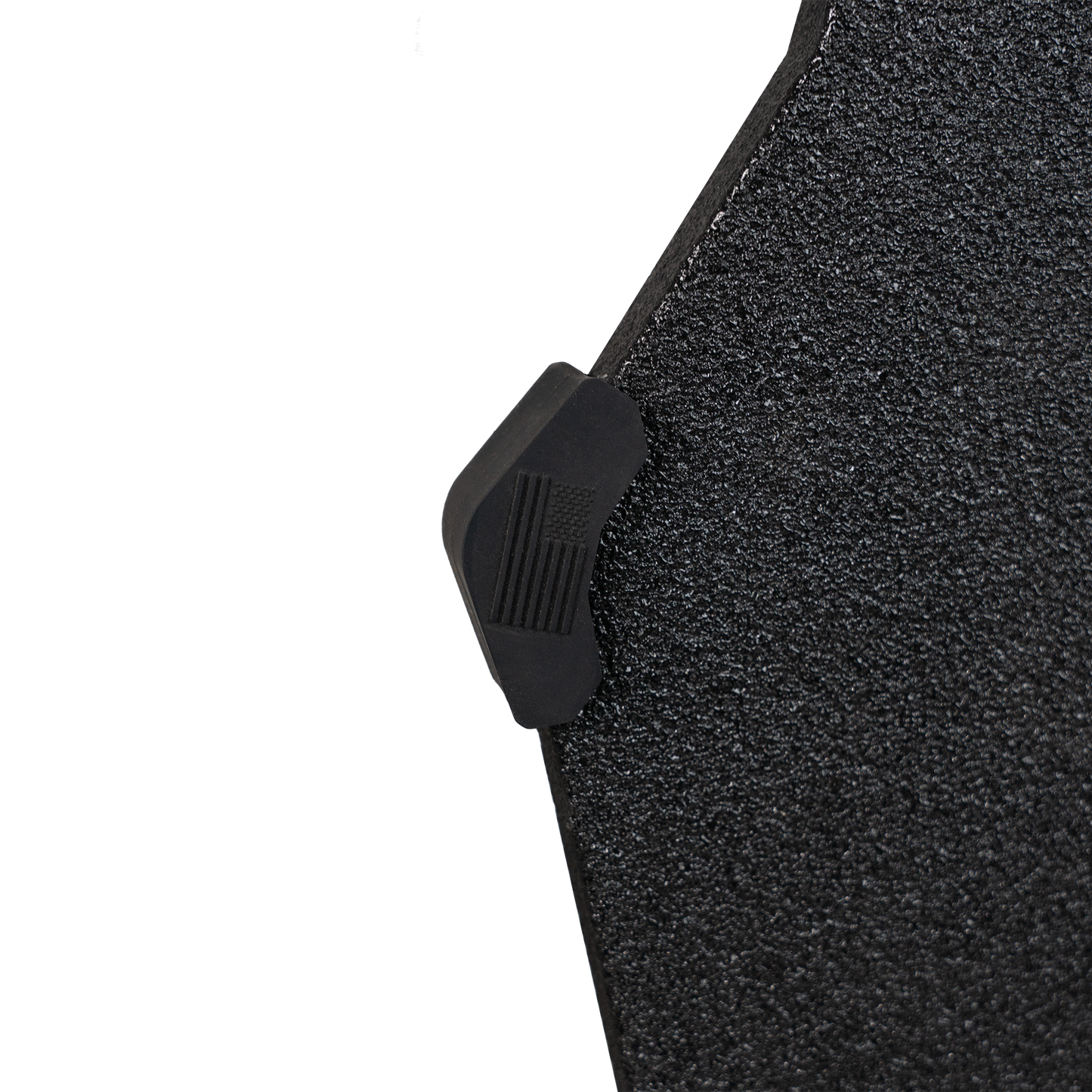 Close-up of a textured black armor plate with a small buffer bumper on the end with American flag.
