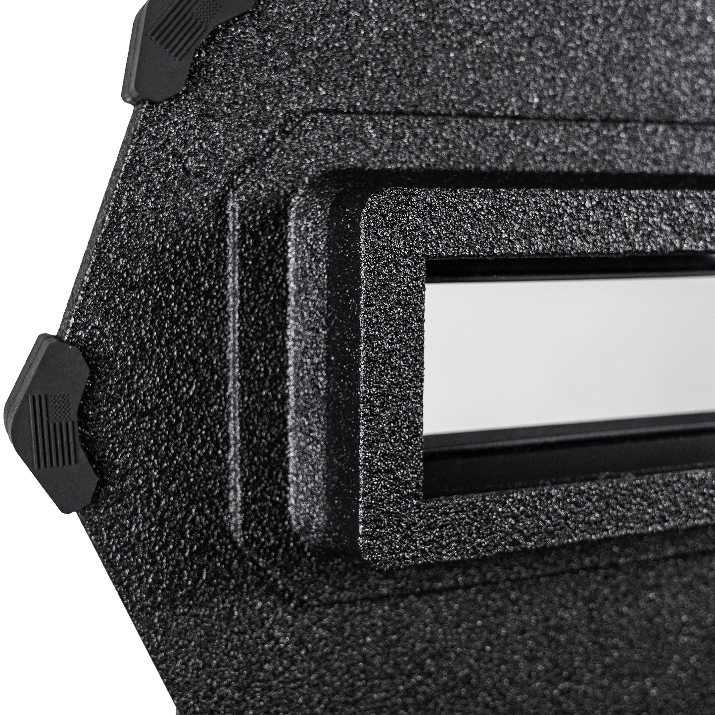 Close-up of a black ballistic shield with a rectangular cutout. The material appears rugged and industrial, with smooth edges and a modern look.