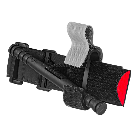 A black and red medical tourniquet with a Velcro strap and plastic twisting mechanism, set against a plain white background.