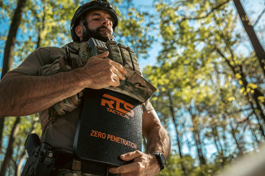 A man putting an RTS Tactical plate into his plate carrier