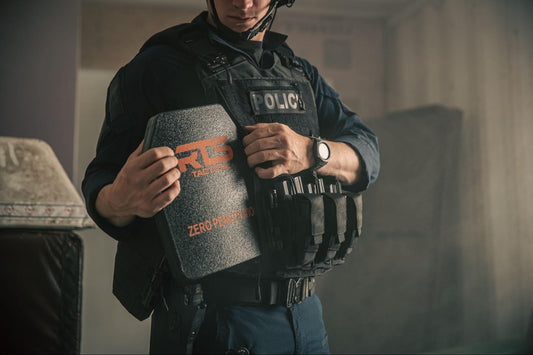 A man putting his RTS Tactical hard armor plate in his plate carrier