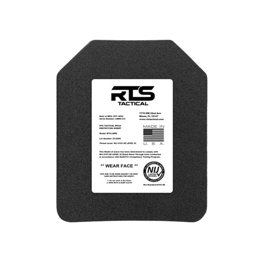 A tactical body armor plate with a white label on the front. The label includes product details, manufacturing standards, and origin