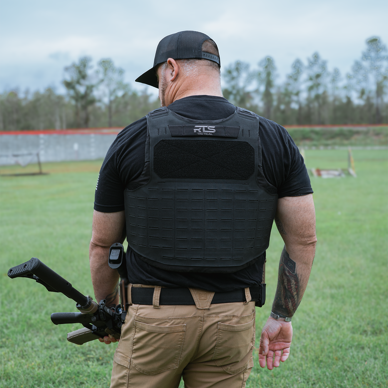 operator with slim tac vest on  