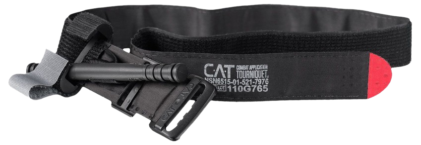Black CAT tourniquet with a windlass, buckle, and red tip. The strap is labeled with medical specifications. Used for emergency bleeding control.