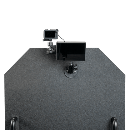 GoPro camera mounted atop a textured, dark bulletproof panel.