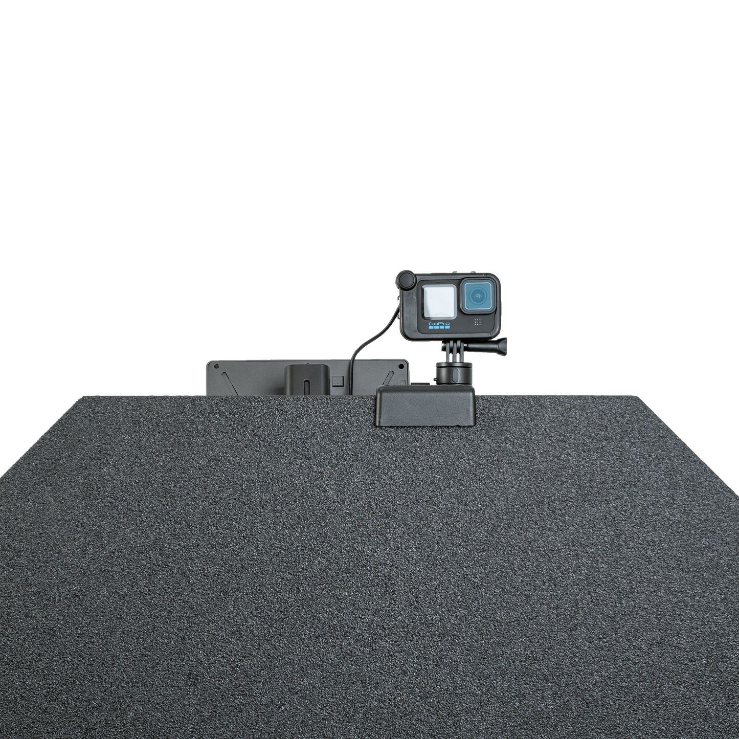 GoPro camera mounted atop a textured, dark bulletproof panel.