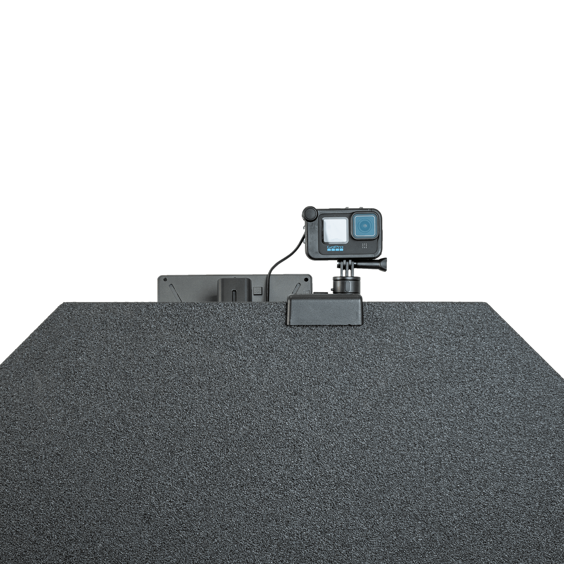 GoPro camera mounted atop a textured, dark bulletproof panel.