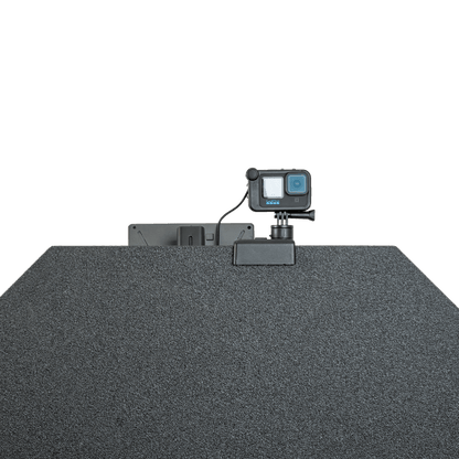 GoPro camera mounted atop a textured, dark bulletproof panel.