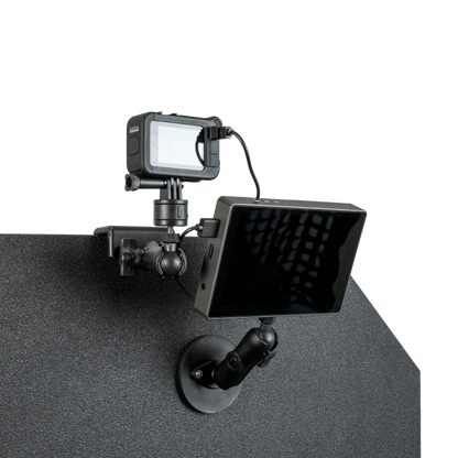 GoPro camera mounted atop a textured, dark bulletproof panel.