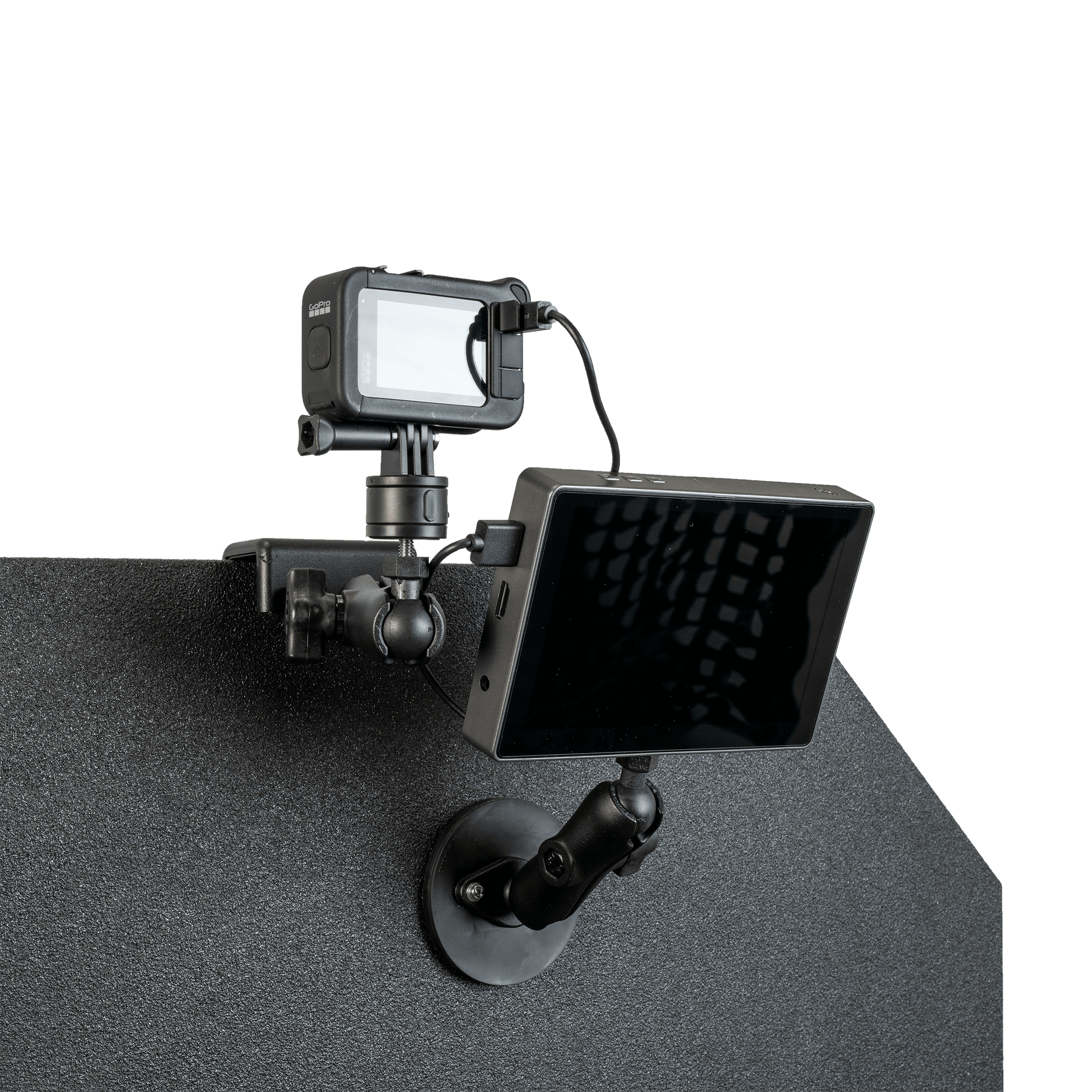 GoPro camera mounted atop a textured, dark bulletproof panel.