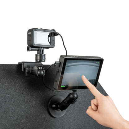 Touch screen with GoPro camera mounted atop a bulletproof panel.