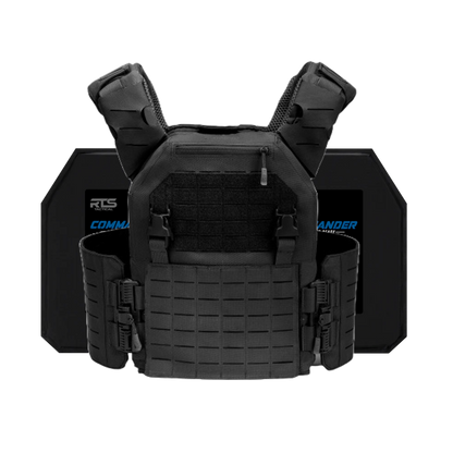 Black tactical vest with padded shoulder straps and multiple buckles is shown in front of two ballistic plates. The vest has a rugged, protective design.