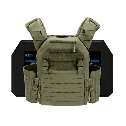 A tactical vest in olive green with MOLLE webbing, adjustable straps, and side buckles. Behind it are two black ballistic plates for protection.