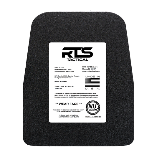 Black armor plate with a white label displaying "RTS Tactical." Text outlines specifications, compliance details, and instructions with a U.S. flag graphic.