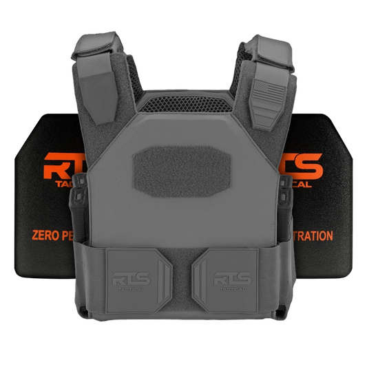 Gray tactical vest with reinforced padding and adjustable straps, displayed in front of two black ceramic panels with orange text.