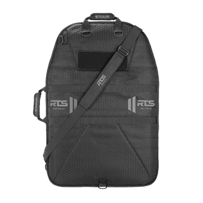 A rugged black tactical bag for ballistic shields, featuring a shoulder strap and handles.