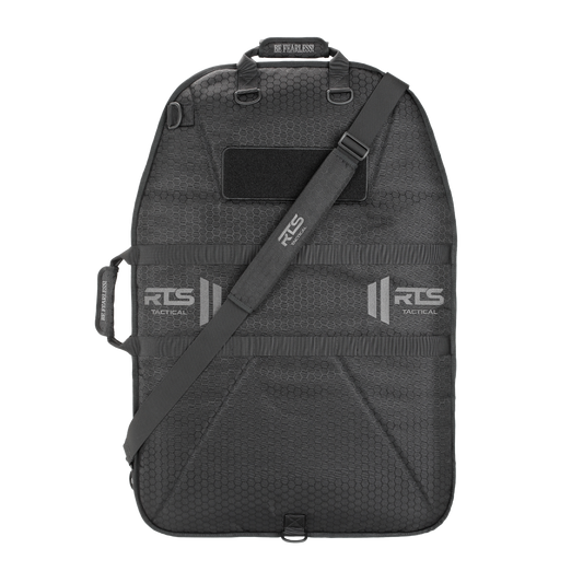 A rugged black tactical bag for ballistic shields, featuring a shoulder strap and handles.