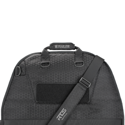A sleek, black, hexagon-patterned bag with a shoulder strap. The handle has "Be Fearless" stitched on it, conveying a bold, empowering tone.