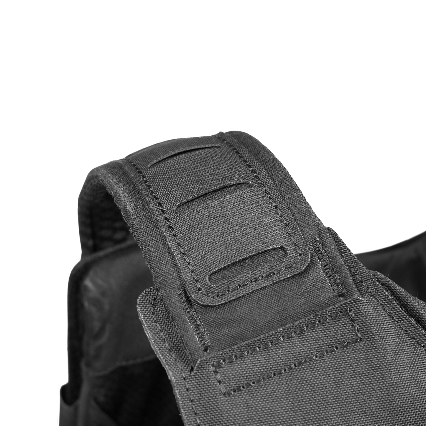 Close-up view of a durable, black tactical vest strap featuring reinforced stitching and adjustable hook-and-loop fasteners.