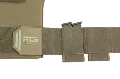 A tactical belt in tan fabric with the "RTS Tactical" logo on a Velcro panel, featuring two slots holding black magazine clips.