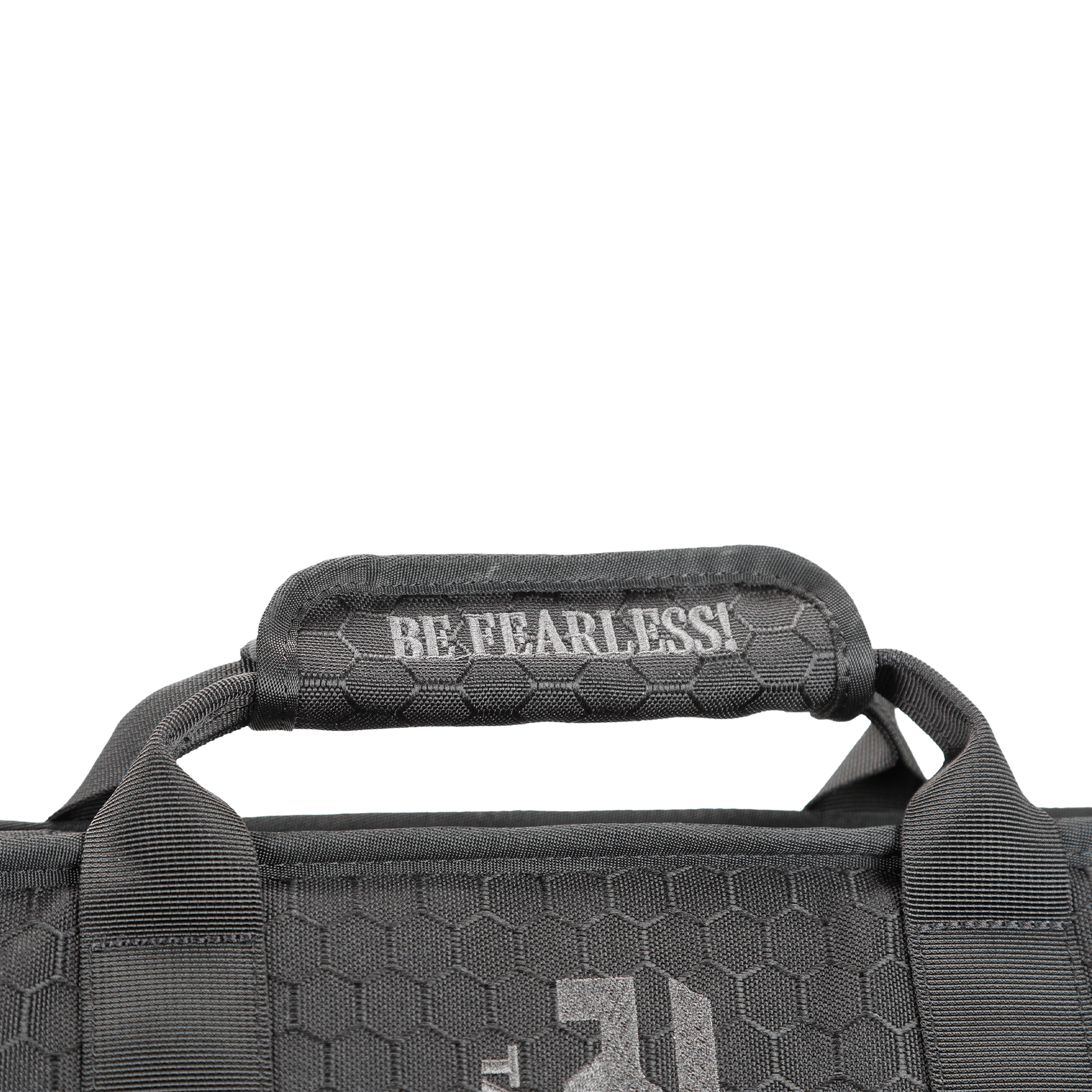 Close-up of a black shield carrier bag handle with a hexagonal texture, featuring the white text "BE FEARLESS!"