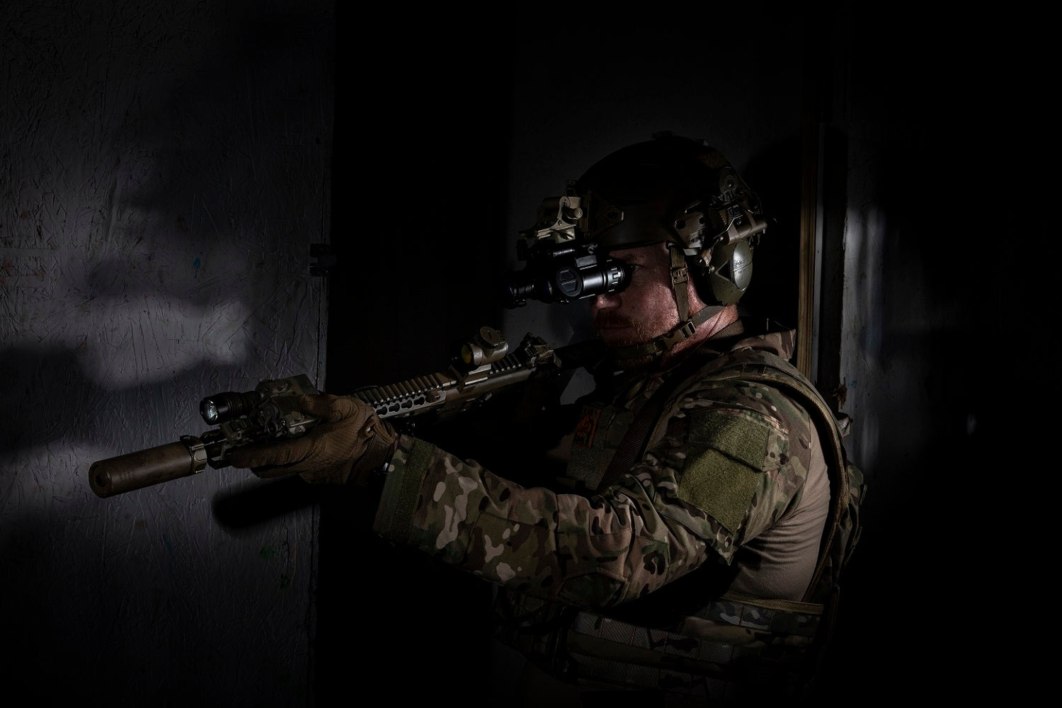 A in full body armor gear from RTS Tactical holding a firearm.