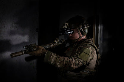 A in full body armor gear from RTS Tactical holding a firearm.