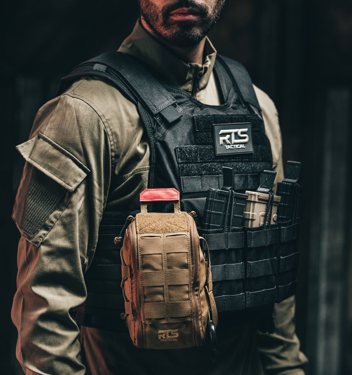 A plate carrier IFAK pouch secured on the front of an RTS Tactical plate carrier.