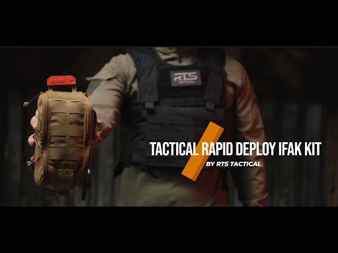 A person in tactical gear holding a Tactical Rapid Deploy IFAK Kit